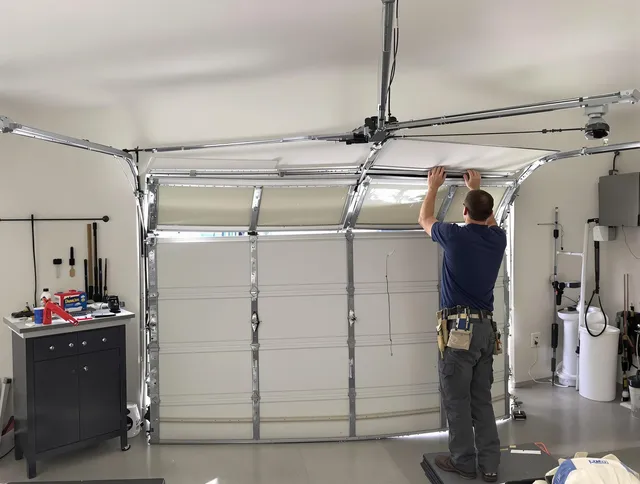 Willoughby Garage Door Repair specialist performing precise section replacement on Willoughby garage door