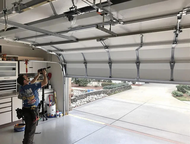 Garage door track repair service by Willoughby Garage Door Repair in Willoughby